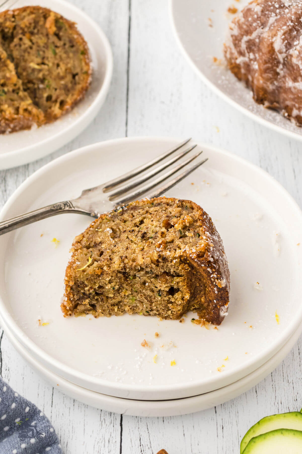 Slice of Olive oil Walnut Cake made with Zucchini and glazed with lemon sugar. 