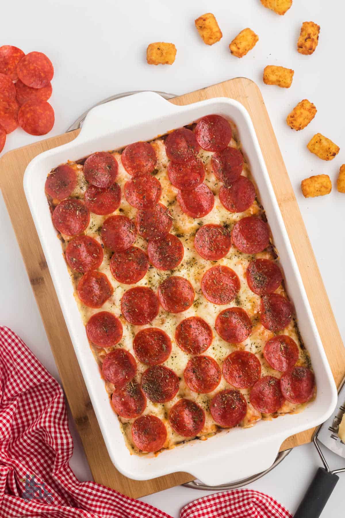 Baked Pizza Casserole made with a tater tot crust and topped with mozzarella and pepperoni. 