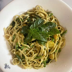 Pasta al Genovese Pesto in a white bowl made with green beans and Yukon Gold potatoes.