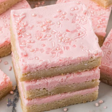 Pink Frosted Sugar Cookie Bars with pink Sprinkles on top.