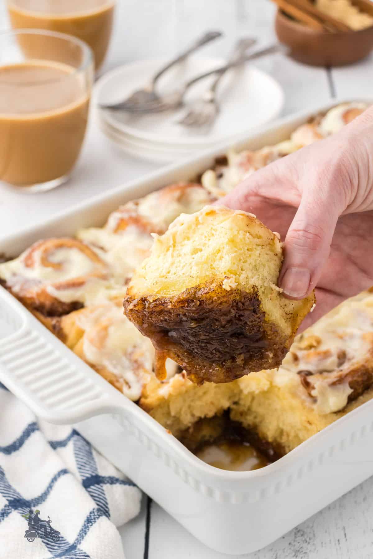 Image of the cinnamon yeast roll bottom covered in gooey caramel sauce. 