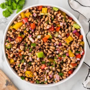 Black-eyed pea salad with colored bell peppers and onions in a savory marinade.