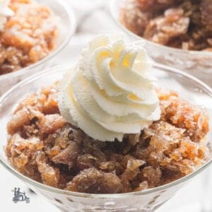 Coffee Granita with a swirling dollop of whipped green in a stemmed glass.