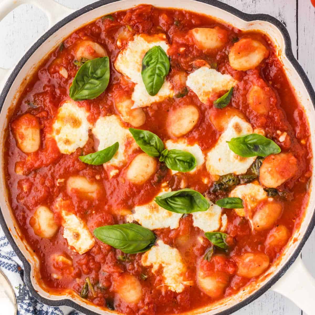 Potato Gnocchi baked in a rich tomato sauce in a cast iron skillet.