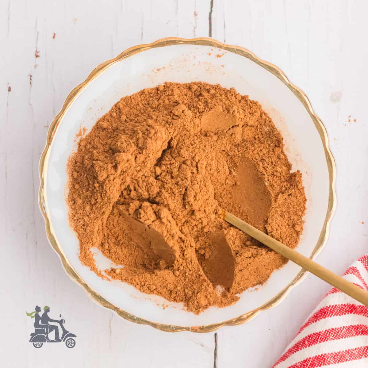 A bowl filled with freshly made homemade apple pie spice.