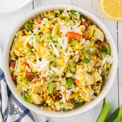 Salad bowl filled with Italian-inspired grilled corn salad.