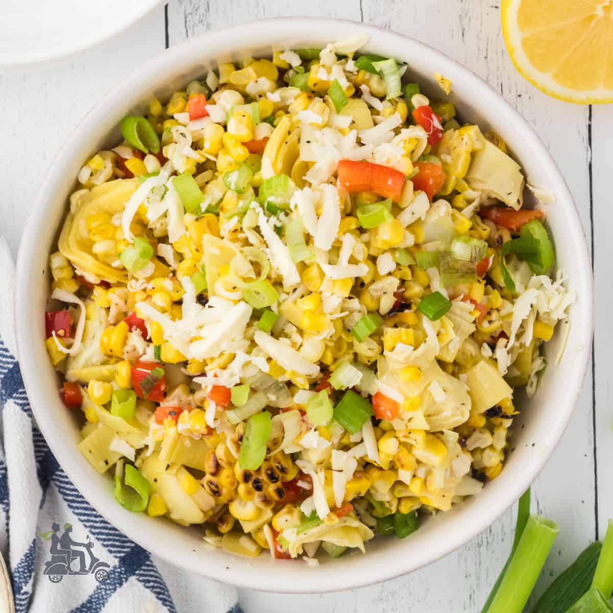 Salad bowl filled with Italian-inspired grilled corn salad.