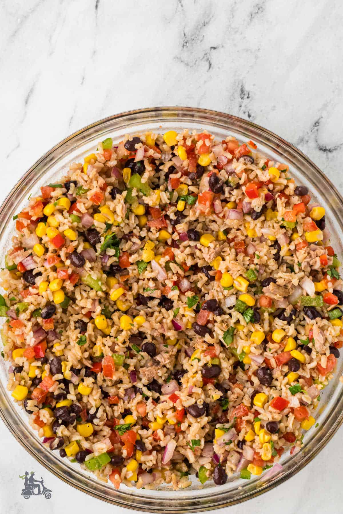 Rice Salad with Tuna in a glass bowl: the salad is made with a Western flair