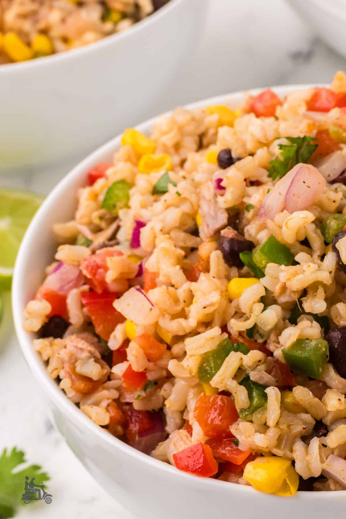 Spicy Honey Lime vinaigrette mixes with rice and tuna for a Cowboy Caviar style salad. 