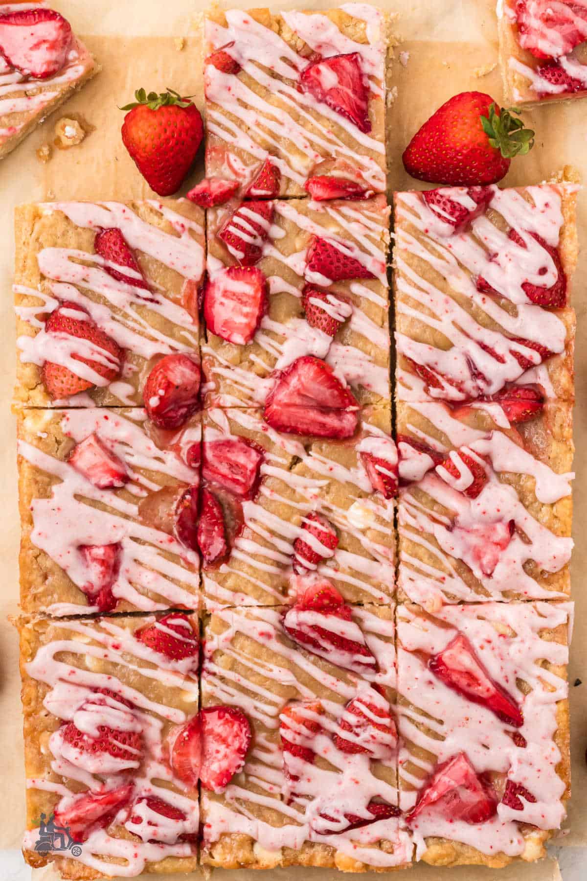 The Strawberry White Chocolate dessert bars are cut into serving pieces. 