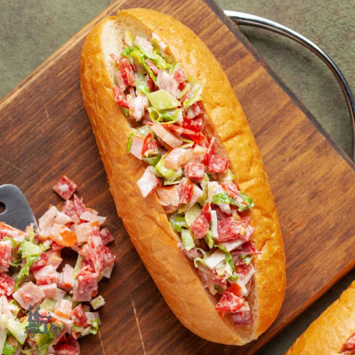 A Hoagie made with Italian Chopped salad filling.