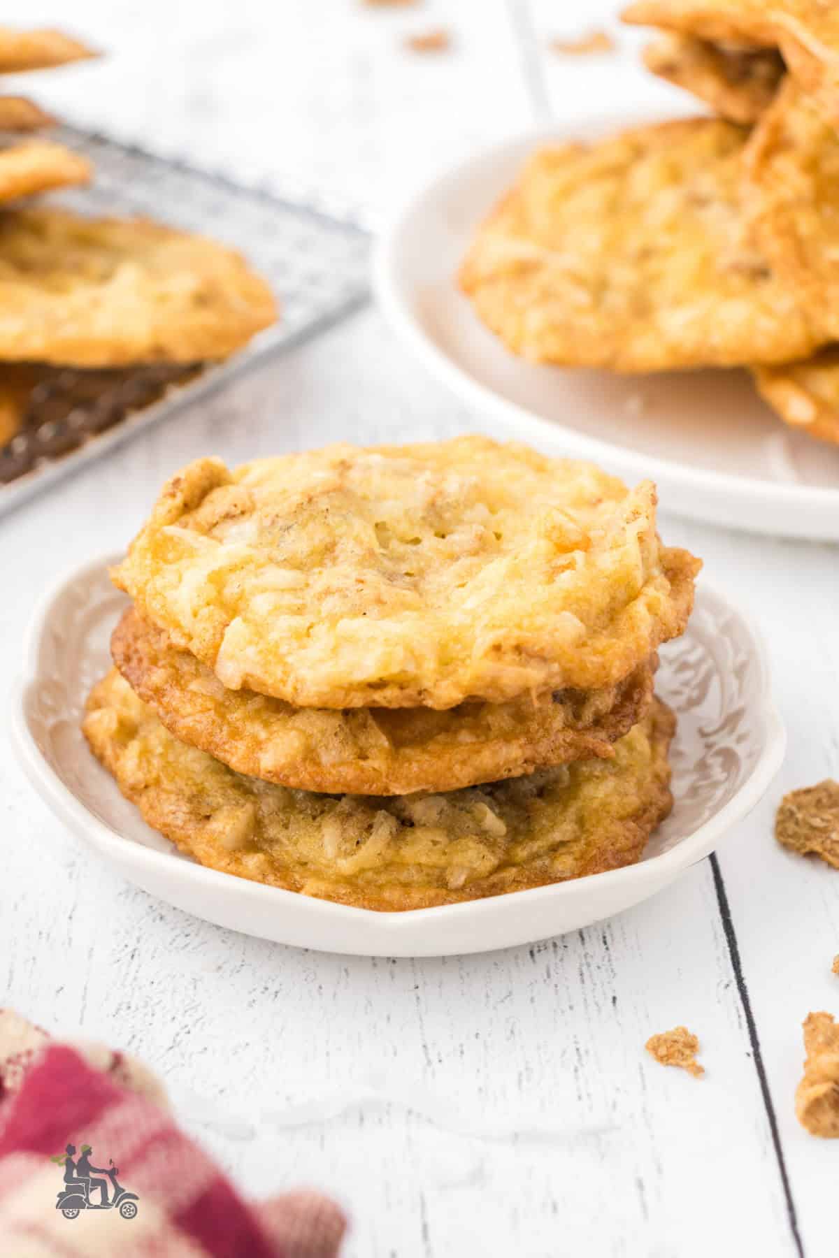 The white dessert plate holds three coconut bran cookies. 