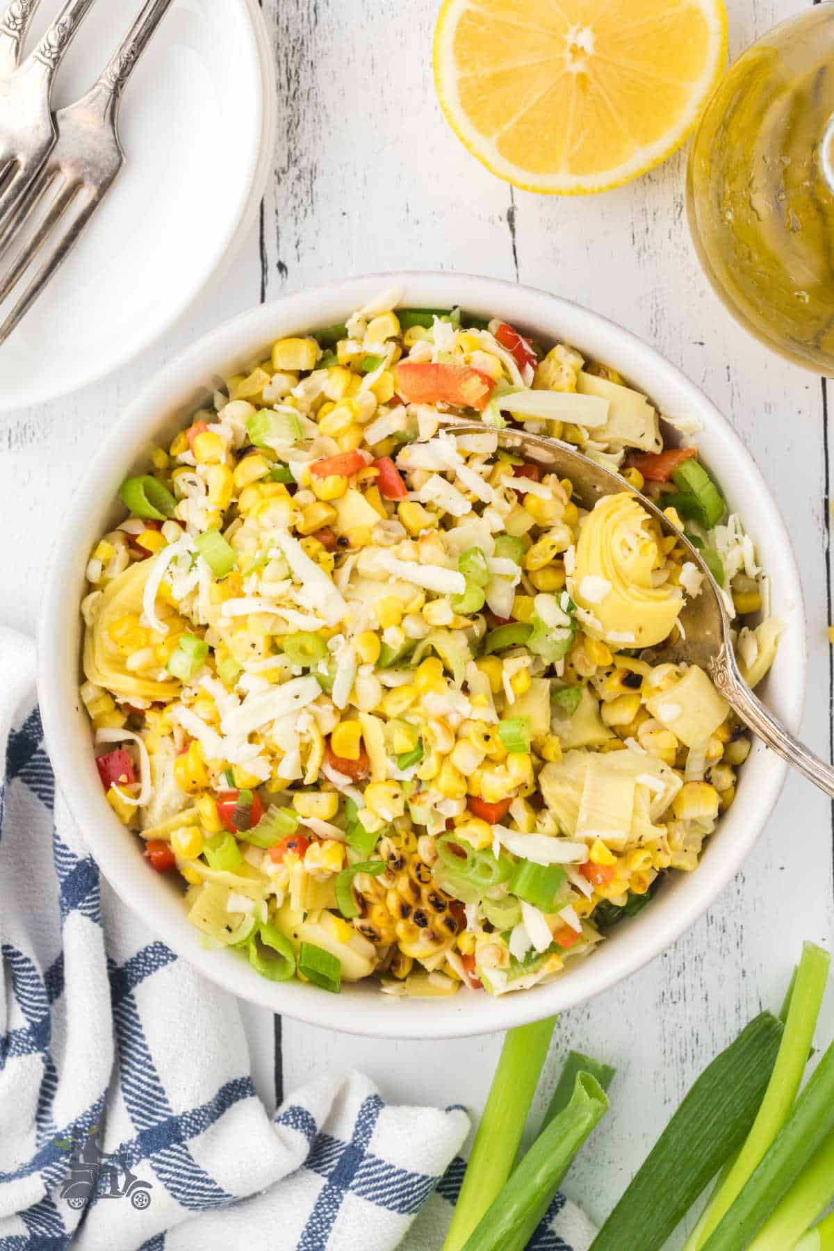 Overhead view of the Italian corn salad made with artichokes and served with a light vinaigrette dressing. 