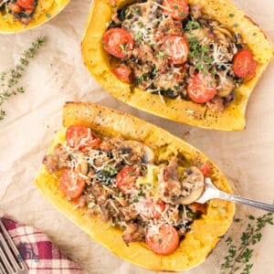 Spaghetti squash halves stuffed with sausage, spinach, mushrooms, and Parmesan cheese.