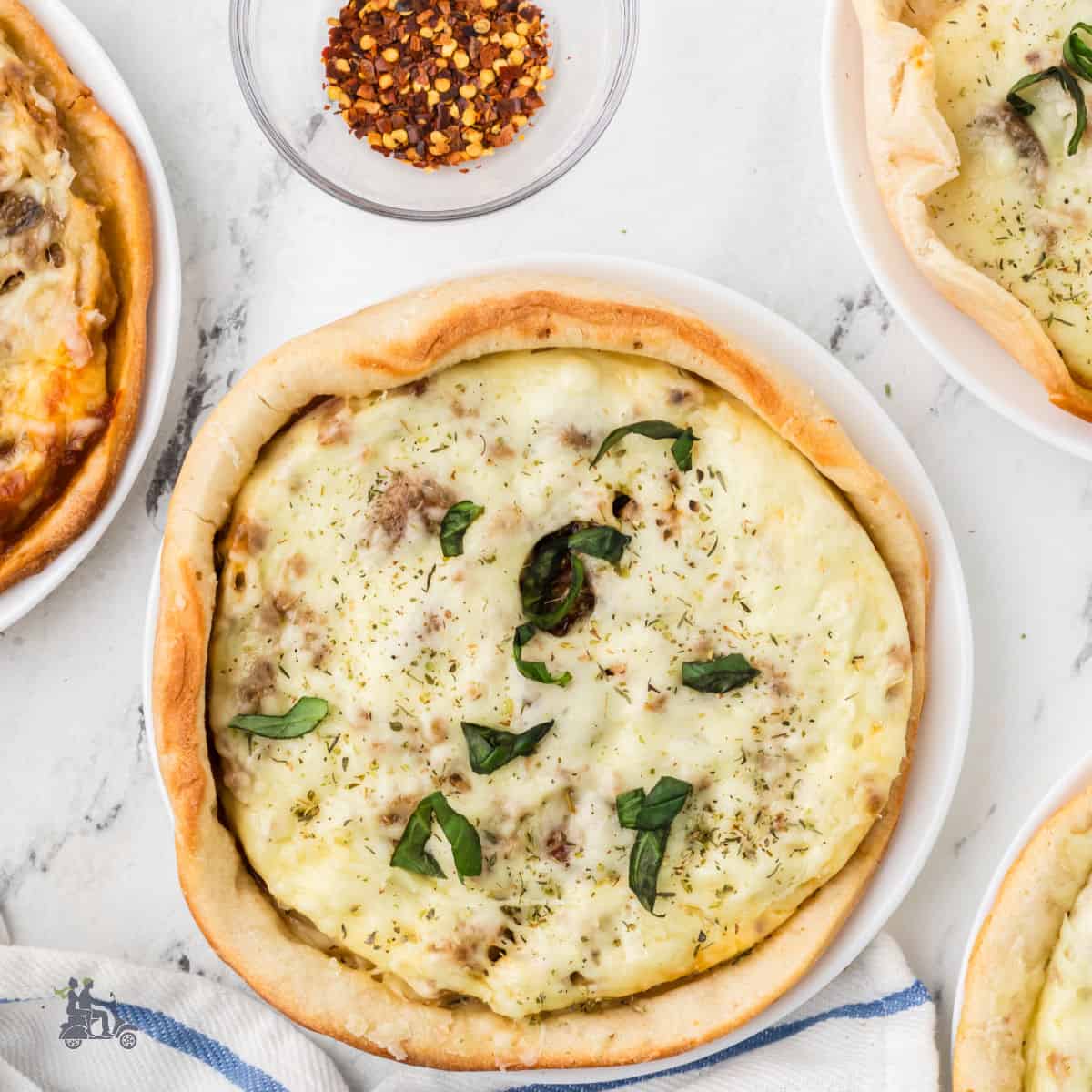 Individual pizza is made like a deep-dish pot pie.