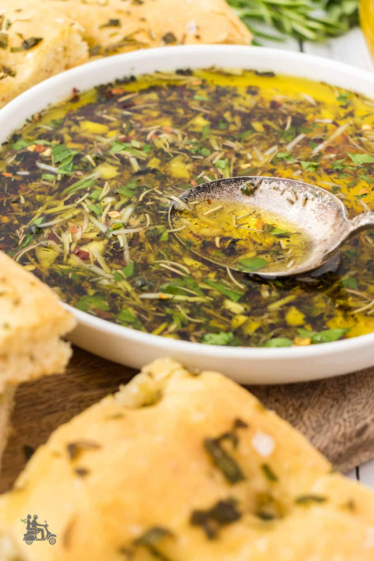 Garlic-infused olive oil with herbs made into an appetizer bread dip. 