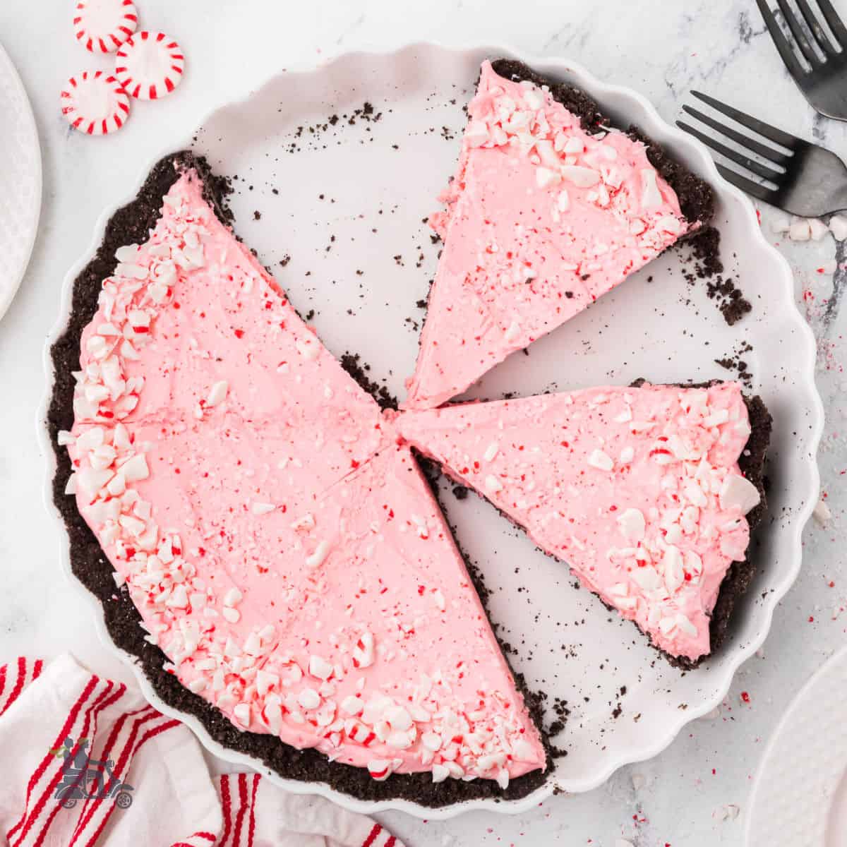 Frozen Peppermint Pie with an Orio Crust on a white pie plate.