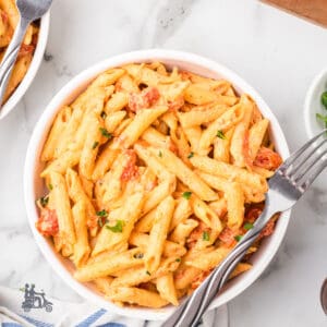 Seasoned Boursin Pasta with Tomatoes baked into a creamy sauce and served with penne pasta.
