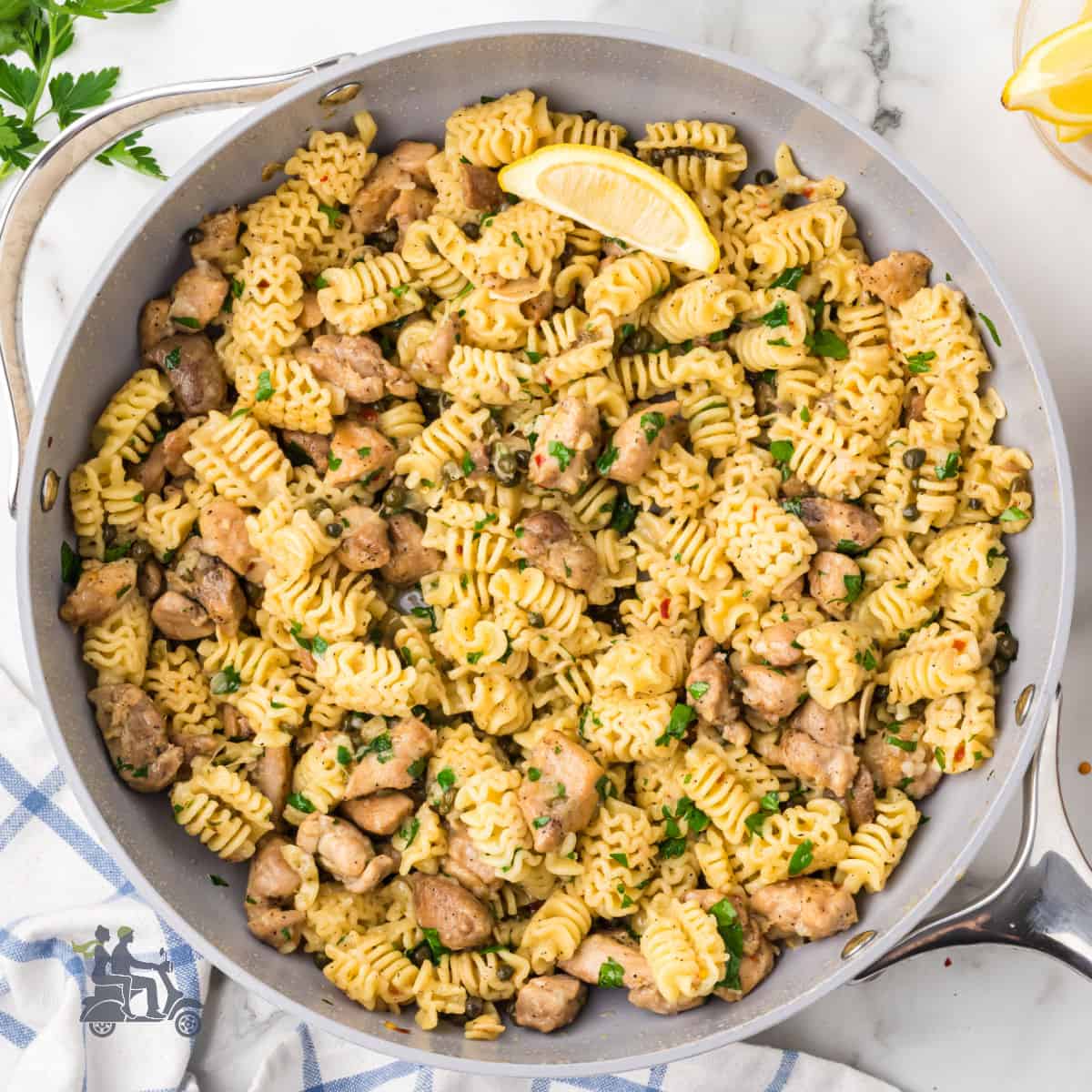 Chicken piccata combine with radiatori pasta for a one-pot dinner.