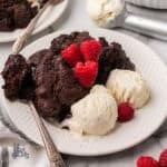 Chocolate Pudding cake laced with amaretto and served with fresh raspberries and vanilla ice cream.