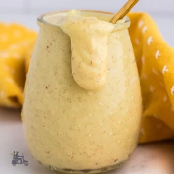Hot honey mustard dressing and sauce are made in a glass jar with three ingredients.