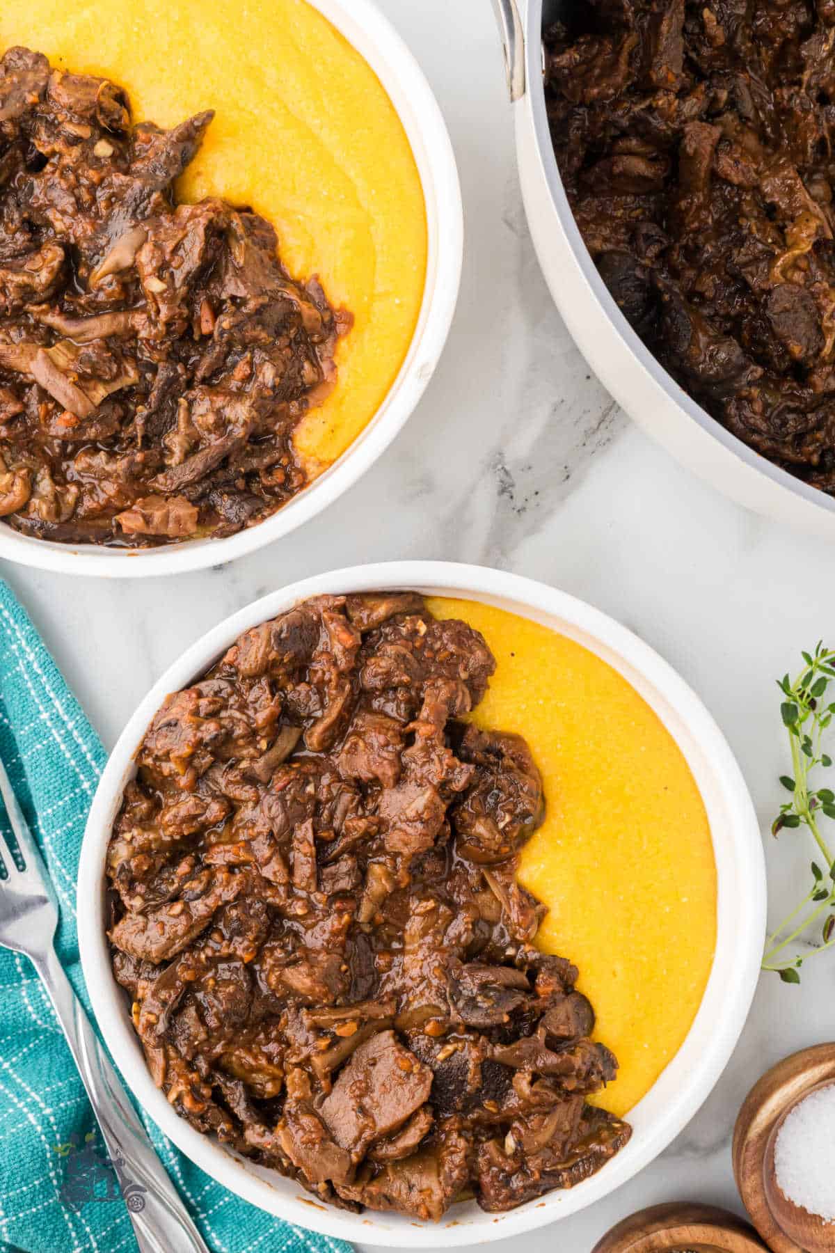 Mushroom sauce made with dried porcini and various mushrooms served over golden polenta. 