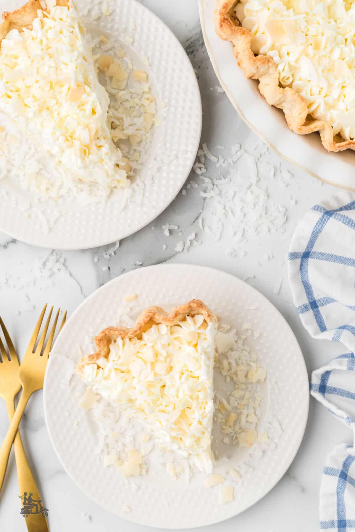 Slices of Triple Coconut Cream Pie on White dessert plates are ready to serve to family or guests.