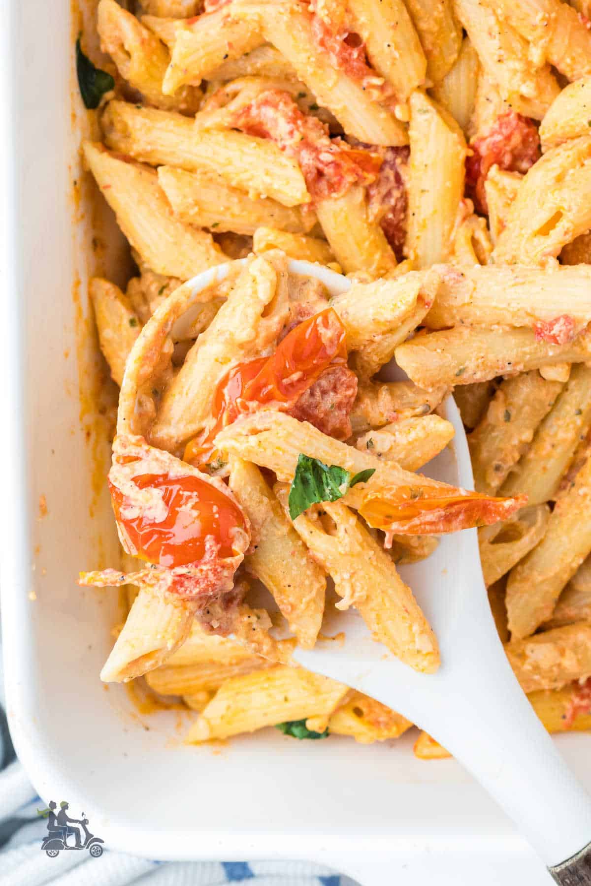 A close-up of a serving spoon grabbing a helping of the completed Boursin Cheese Pasta recipe. 