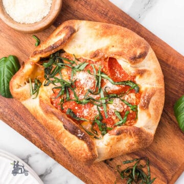 Pizza Dough stuffed with Brie cheese and topped with pizza sauce, pepperoni, and two cheeses.