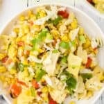 A long share pin with a title overlay for the grilled corn salad recipe with Italian flavors.