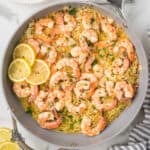 Weeknight shrimp dinner made in one skillet with lemon and tarragon over orzo pasta.