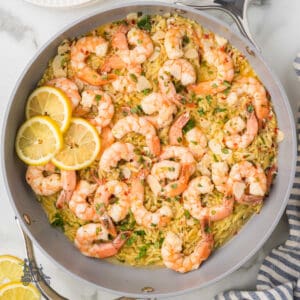Weeknight shrimp dinner made in one skillet with lemon and tarragon over orzo pasta.