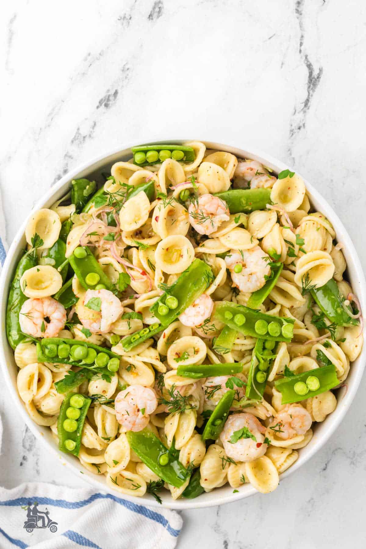 Snap peas, shrimp, and pasta salad with a honey mustard vinaigrette.
