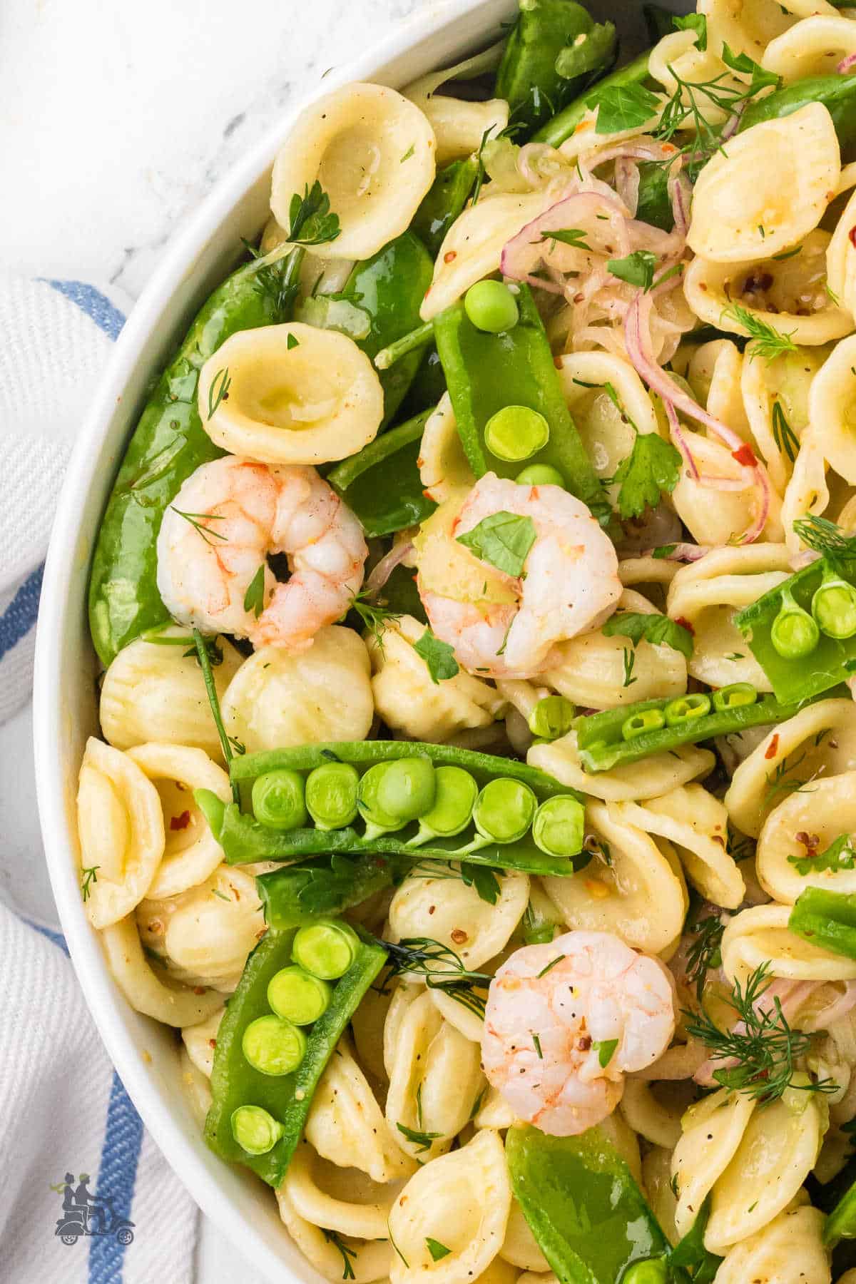 A Southern-inspired shrimp pasta salad with sugar snap peas for a light summer salad.