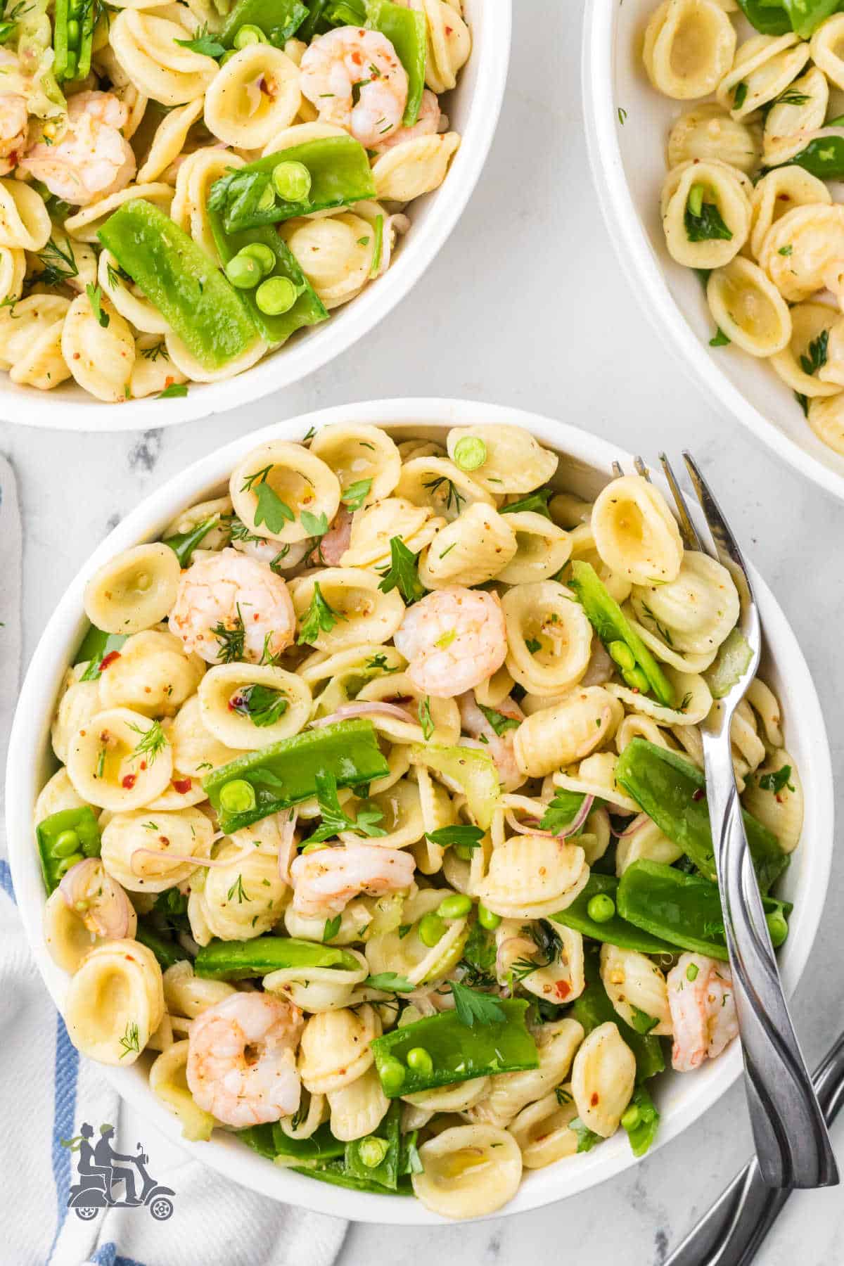 A bright and fresh shrimp salad with sugar snap peas and a lemon-herb vinaigrette.