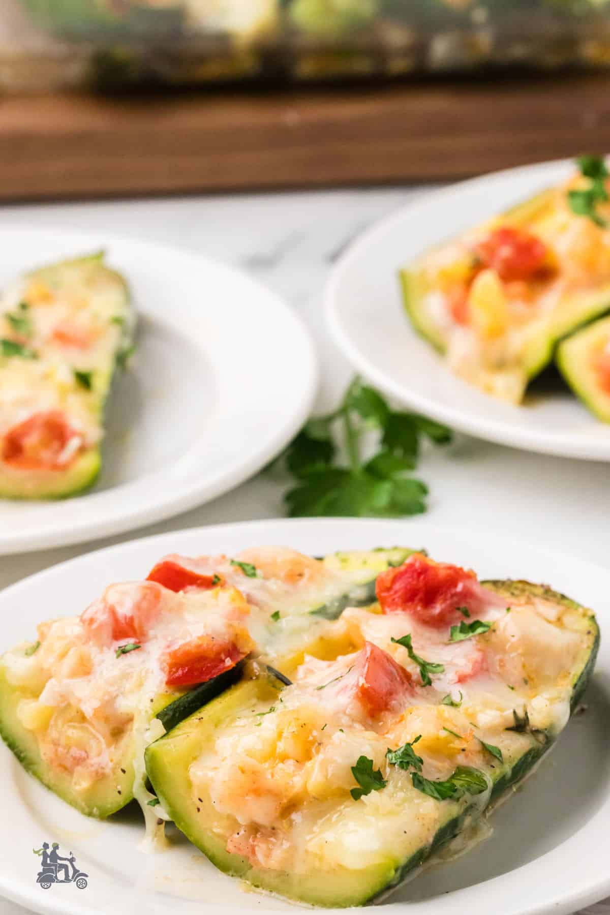 Family-friendly shrimp and zucchini dinner recipe with the creamy shrimp stuffed into zucchini boats.