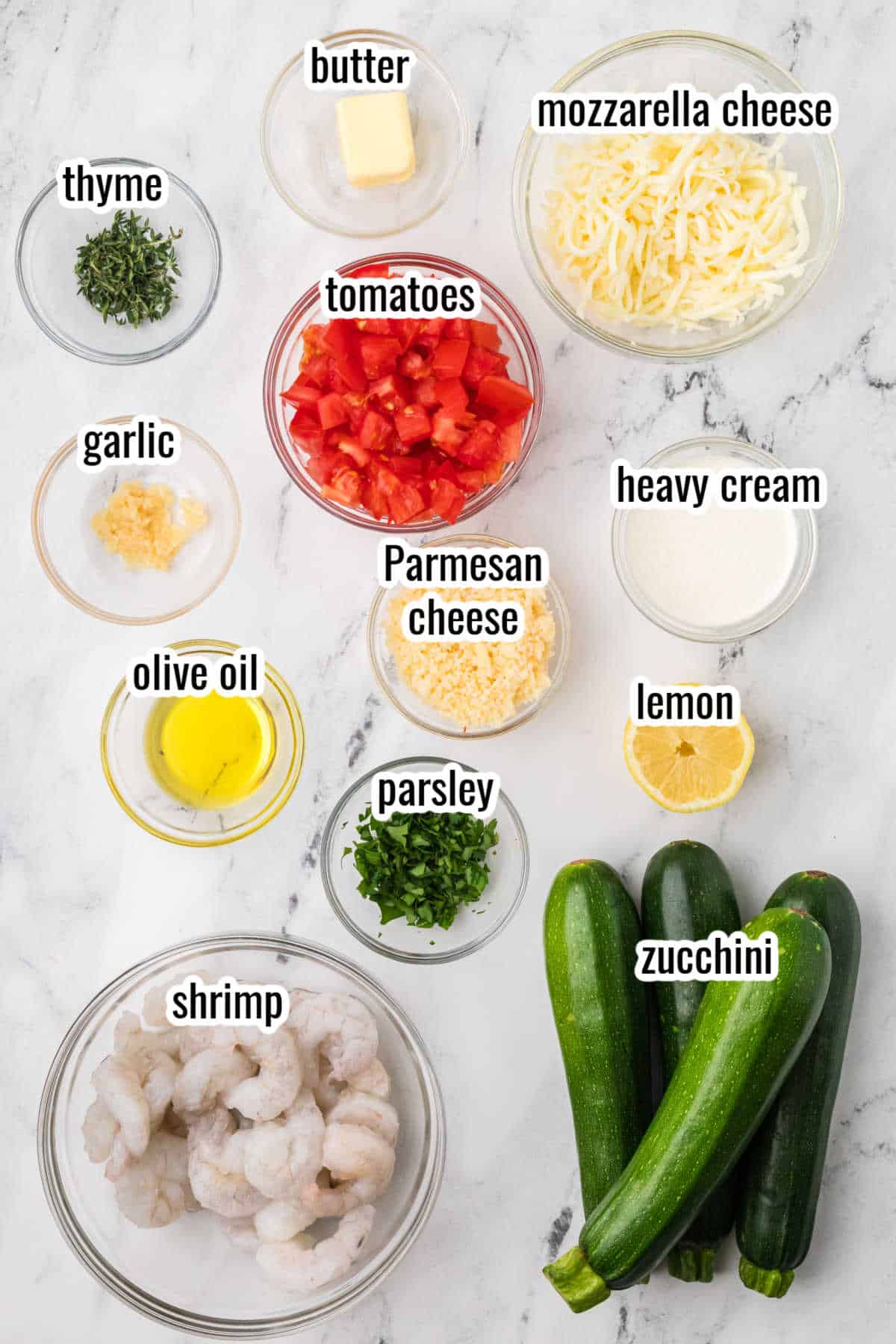 An Image of the ingredients needed to make the Garlicky Shrimp Zucchini Boats recipe.
