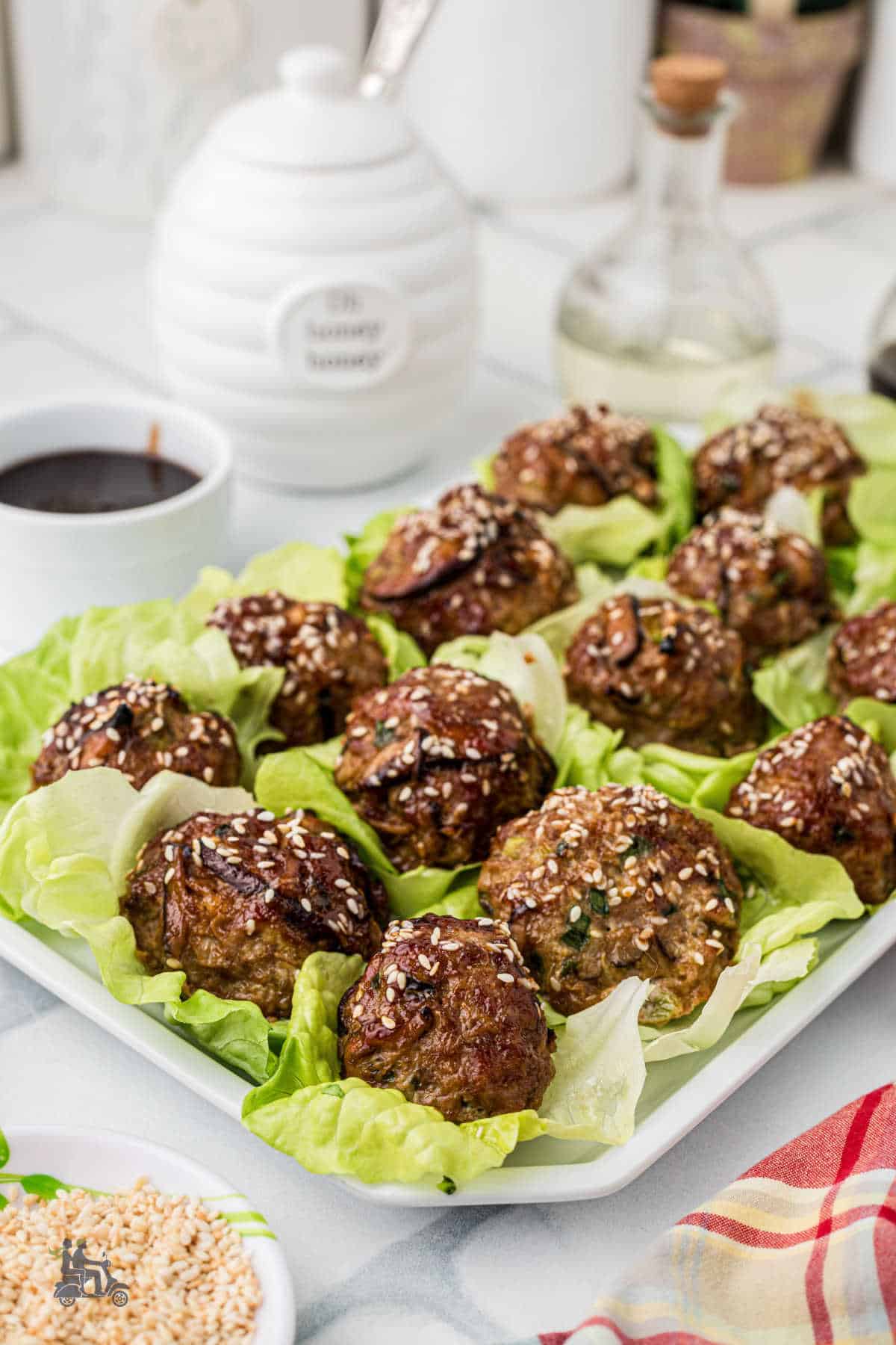Healthy Asian meatballs served on lettuce on the table. 