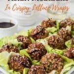 A Pinterest pin with title overlay shows the garlicky pork meatballs with Asian sauce in lettuce cups.