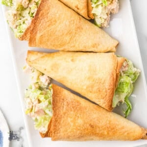 Flour tortillas are baked into cones and filled with chicken caesar salad topped with Parmesan cheese.