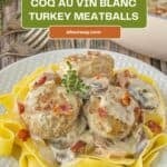 A Pinterest pin shows a white plate. It has egg noodles and turkey meatballs made in the Coq au Vin style on top.