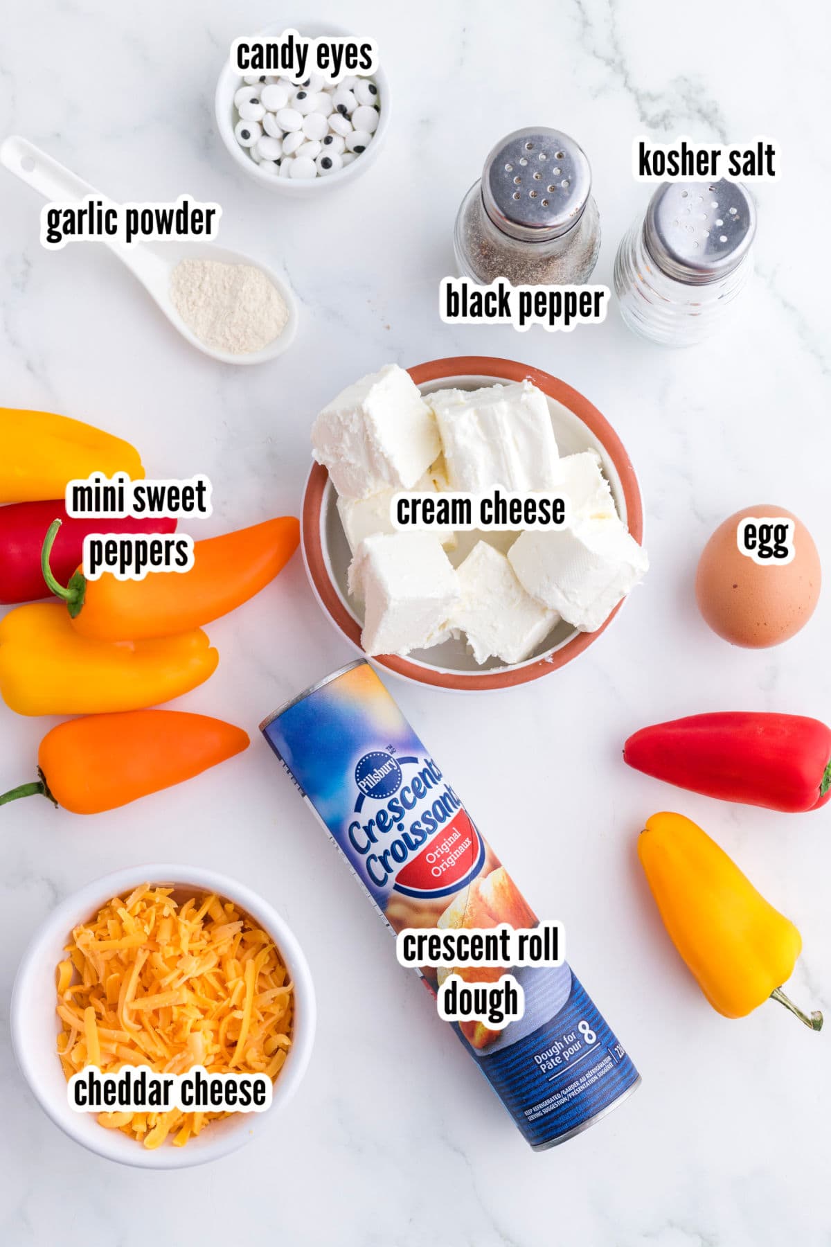 Ingredients needed to make the cheese-stuffed mini pepper Halloween appetizer recipe.  