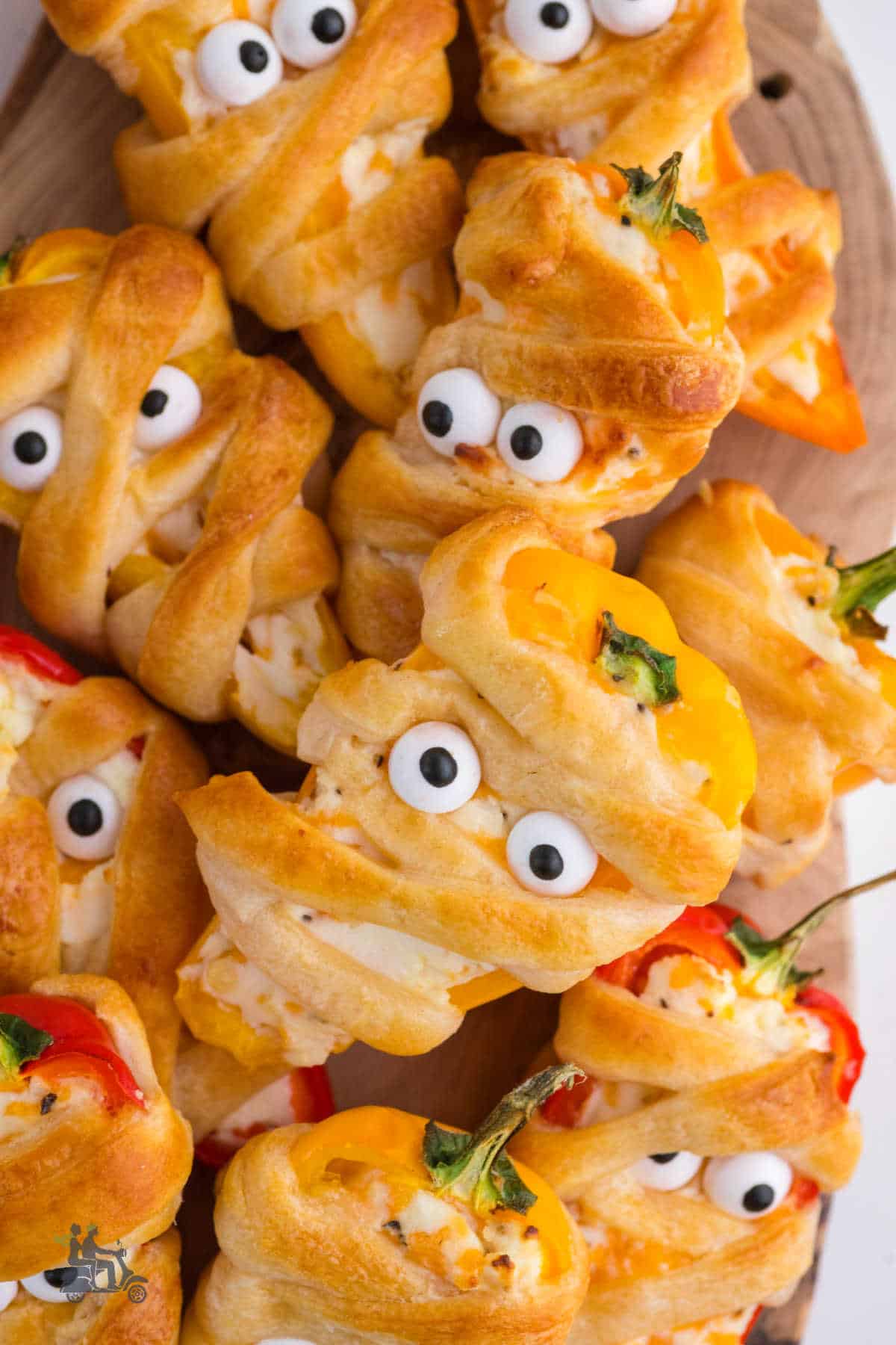 Closeup of the spooky but cut Halloween snacks made with sweet bell peppers and stuffed with cream and cheddar cheese. 