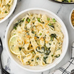 Greek-inspired creamy tagliatelle pasta with spinach, lemon, and feta cheese.