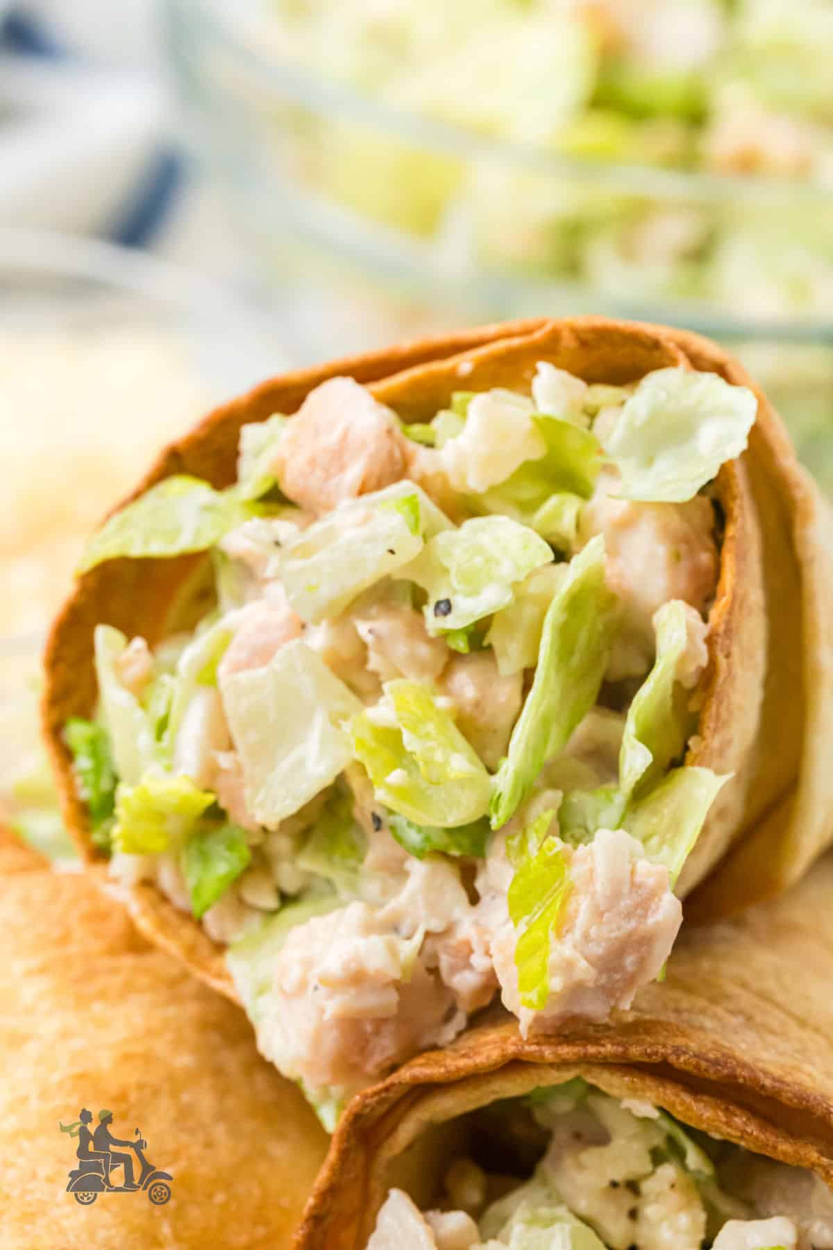 Close-up of a Walk-About Salad cone filled with Caesar salad.