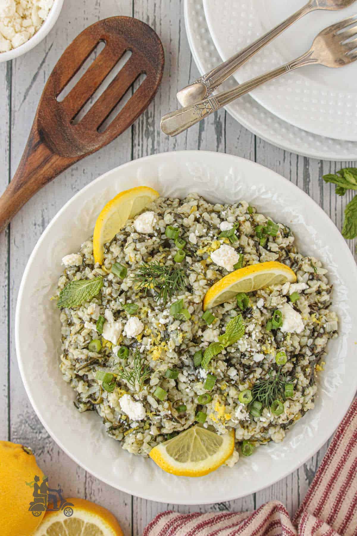 An easy Greek inspired side dish made with rice, spinach, herbs, and lemon. 