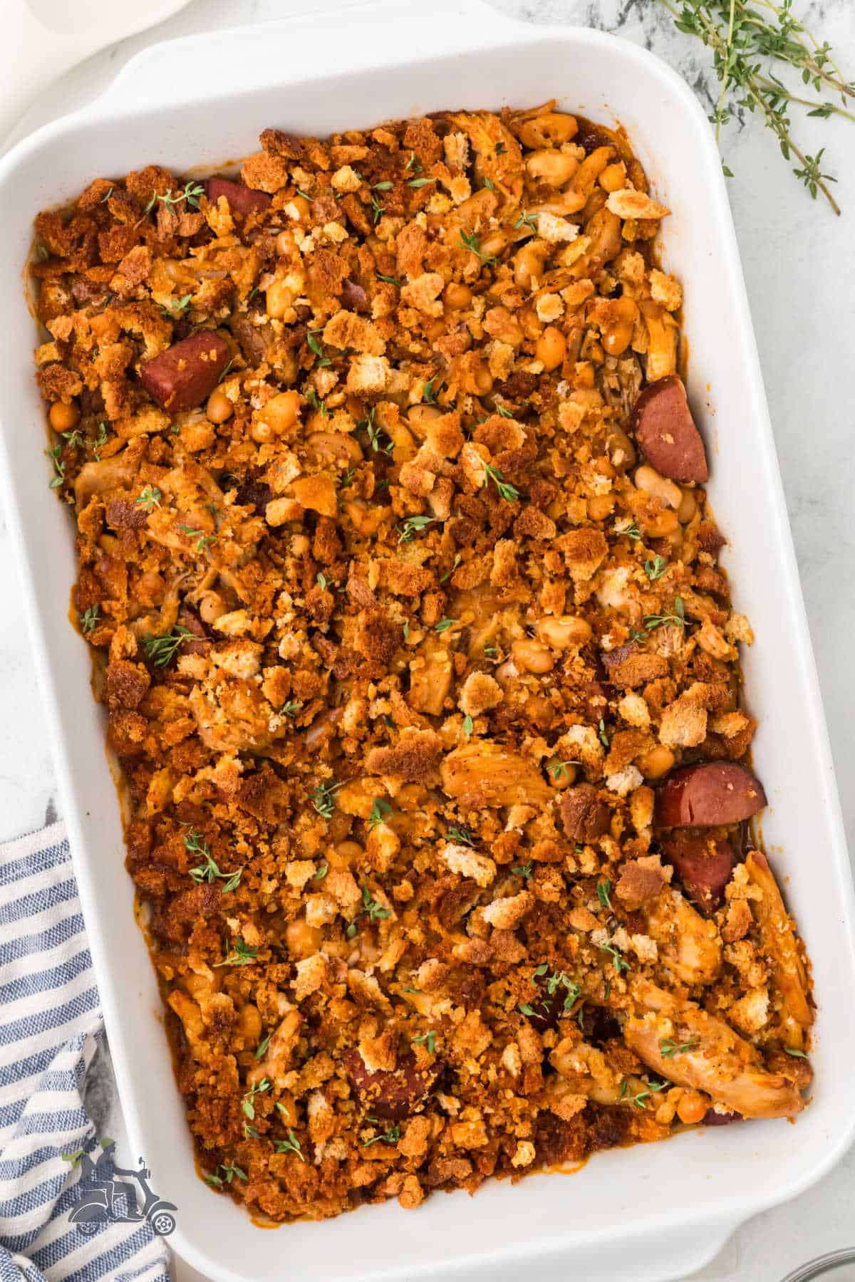 French cassoulet made with chicken, sausage, and beans in a casserole dish. 