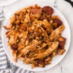A quick and hearty French cassoulet with white beans and thyme on a white serving plate.