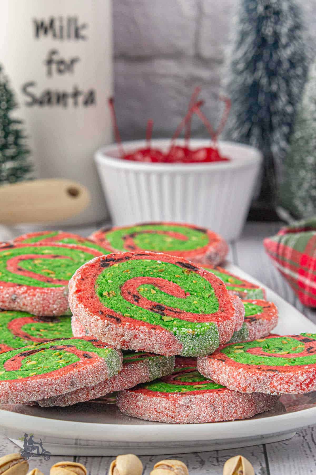 Festive red and green Christmas pinwheel cookies with cherry and pistachio flavoring.