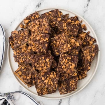 A dessert plate covered with a simple recipe of saltine crackers made into chocolate toffee.
